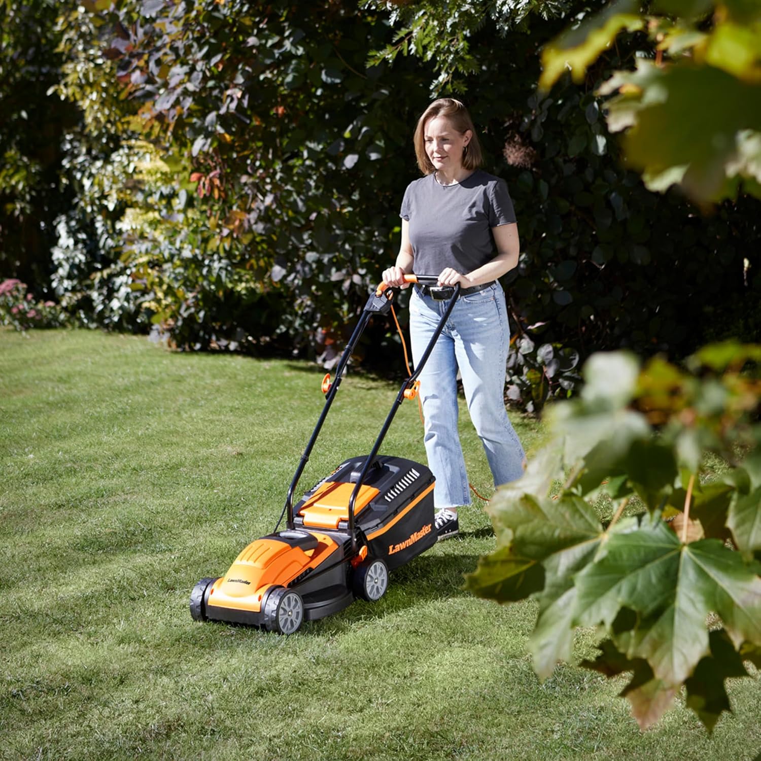 LawnMaster 1200W Electric Lawn Mower with 32cm cutting width, ideal for small lawns. With 5 adjustable cutting heights and rear roller for striped finish, 2 year guarantee